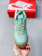 Top view showing the mint green toe box, padded tongue and matching laces.