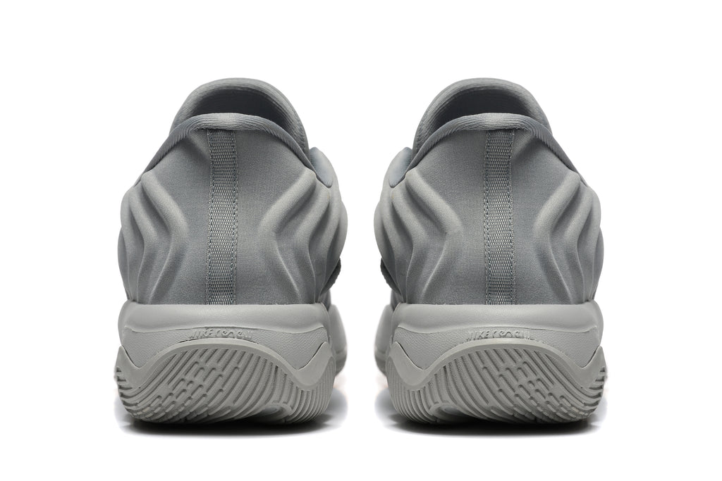 Rear view of the gray sneakers showing padded heels and sculpted soles