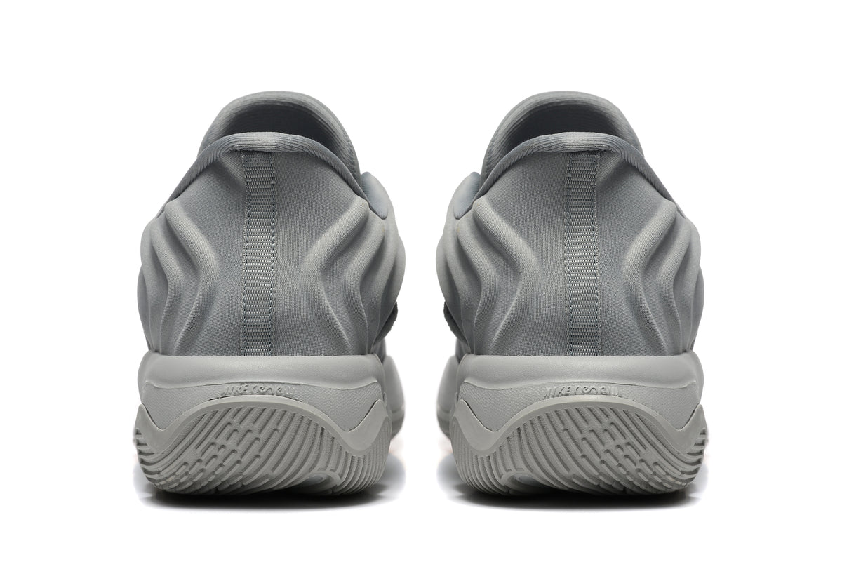 Rear view of the gray sneakers showing padded heels and sculpted soles