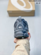 Rear view showing the heel construction and GEL branding on the gray sneaker.