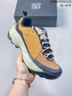 Angled side view showing the upper, laces, toe bumper, and treaded outsole.
