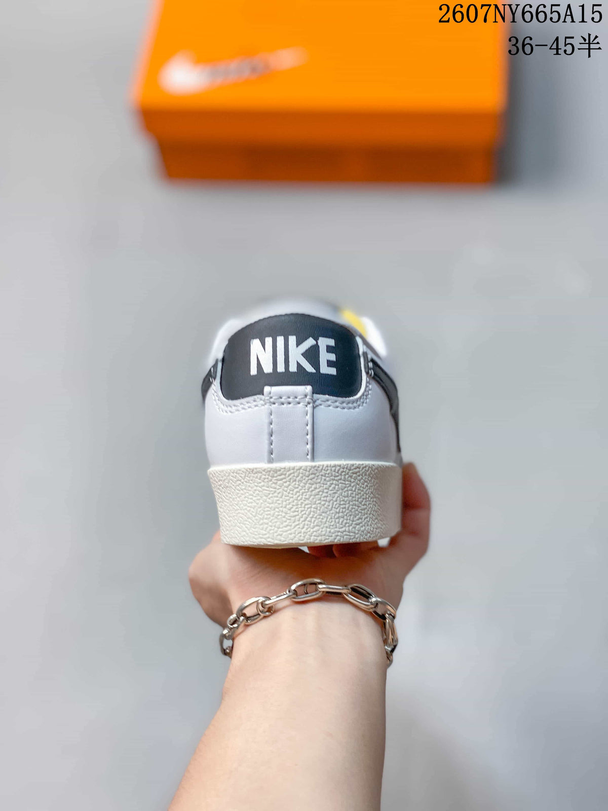 Rear view showing the Nike branding on the black heel label and the textured off-white sole.