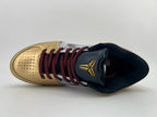 Top-down view of one shoe with perforated toe, patterned laces, and dark tongue.