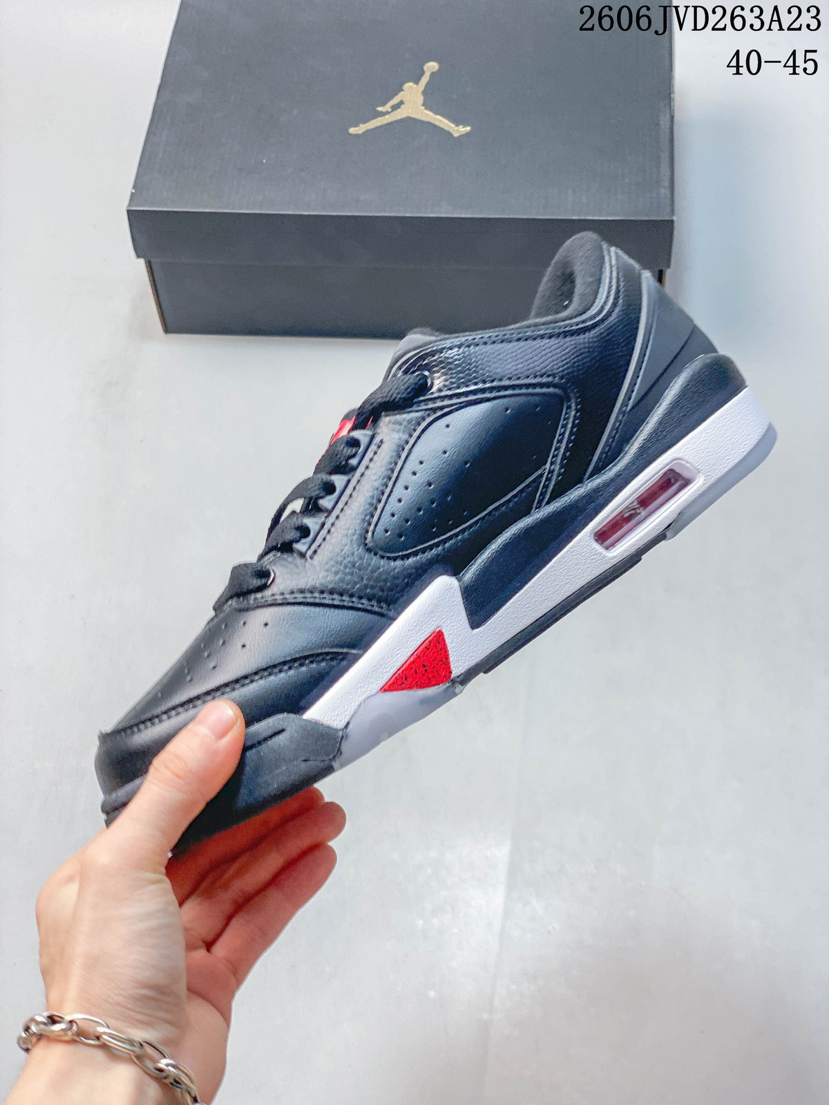 Side profile showing perforated panels, a visible heel window, and red and white accents