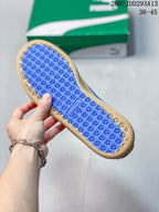Blue patterned outsole of the PUMA sneaker shown from below.