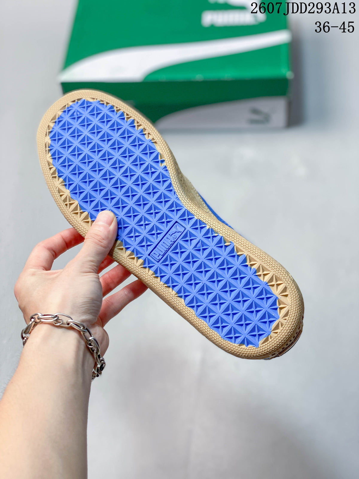 Blue patterned outsole of the PUMA sneaker shown from below.