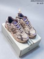 Pair of beige and taupe adidas Response CL sneakers with purple accents displayed on a Bad Bunny box