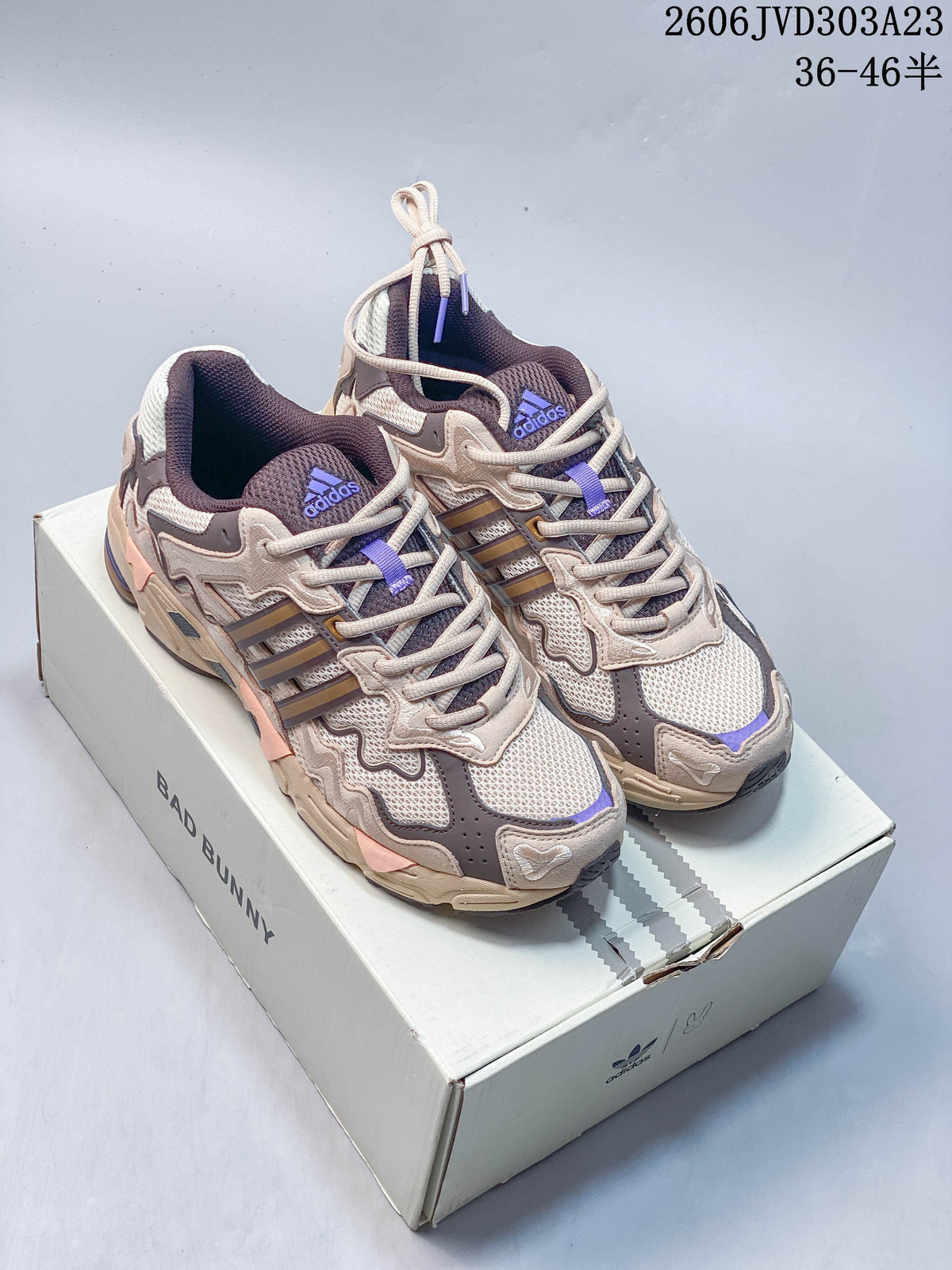 Pair of beige and taupe adidas Response CL sneakers with purple accents displayed on a Bad Bunny box