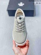 Top view showing the rounded toe, lace-up construction, eyelets, and Descente tongue logo.