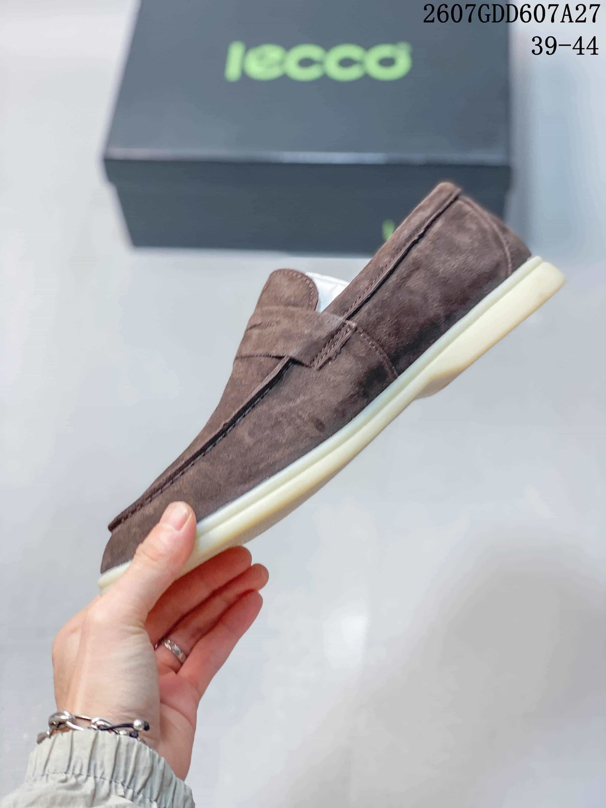 Side profile of a brown ECCO loafer showing the slip-on construction, penny strap and contrasting outsole.