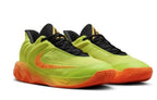 Yellow-green basketball shoes with orange accents.