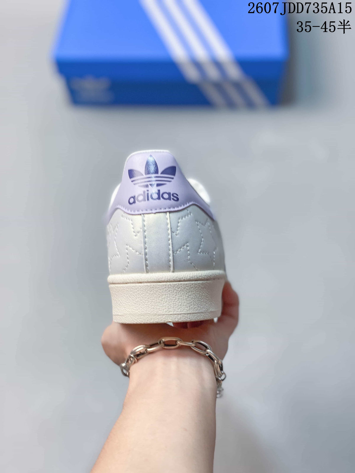 Rear view showing the padded heel, lavender heel detail, and adidas trefoil branding.