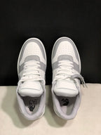 Top view showing perforated toe boxes, white laces, tongue panels, and branded footbeds.