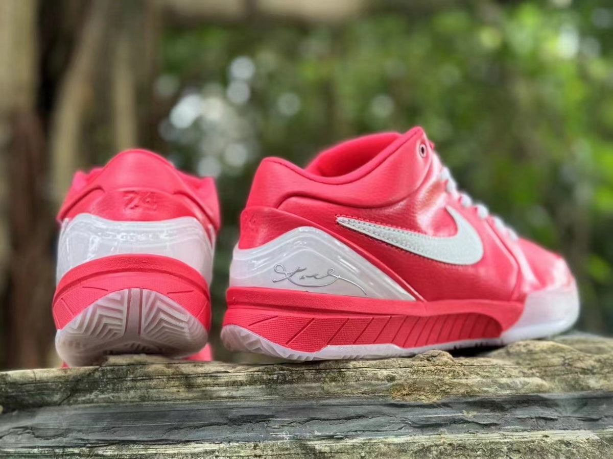 Rear and side views of pink Nike Kobe 4 shoes with translucent heel panels.