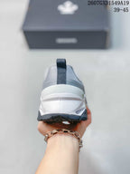 Rear view of the sneaker showing the padded heel collar, pull tab and layered white midsole.