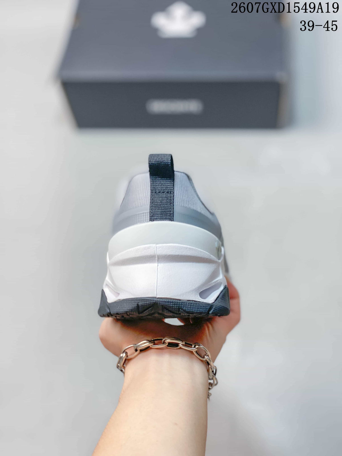 Rear view of the sneaker showing the padded heel collar, pull tab and layered white midsole.