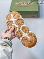 Close-up of the sandal outsole showing a gum-colored base and molded tread pattern; style code JJD267A27 and size range 36–45 are visible above.