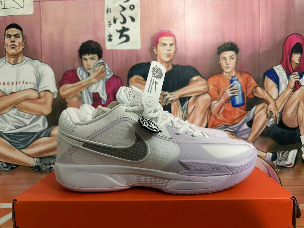 Side view of a light Nike basketball shoe with a Swoosh and perforated panels