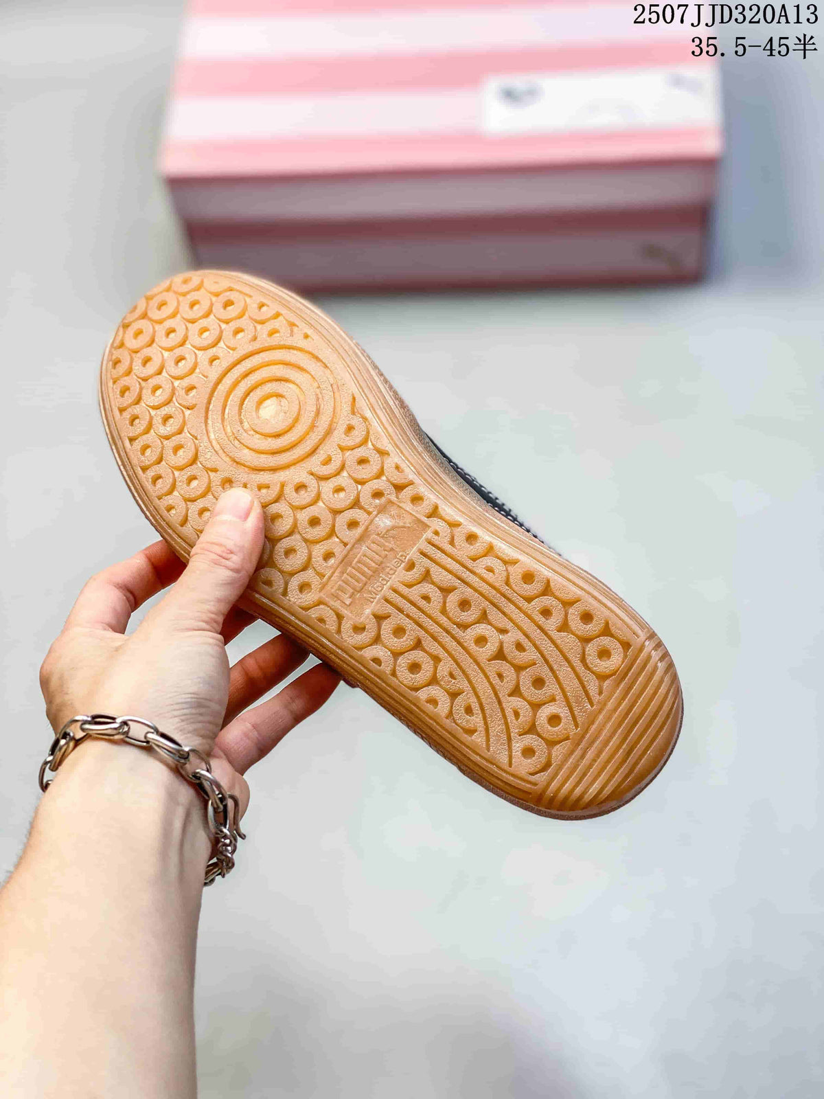 Close-up of the gum-colored outsole showing its circular and textured tread pattern.