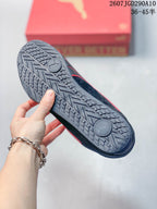 Close view of the sneaker outsole showing a patterned rubber tread with circular sections.