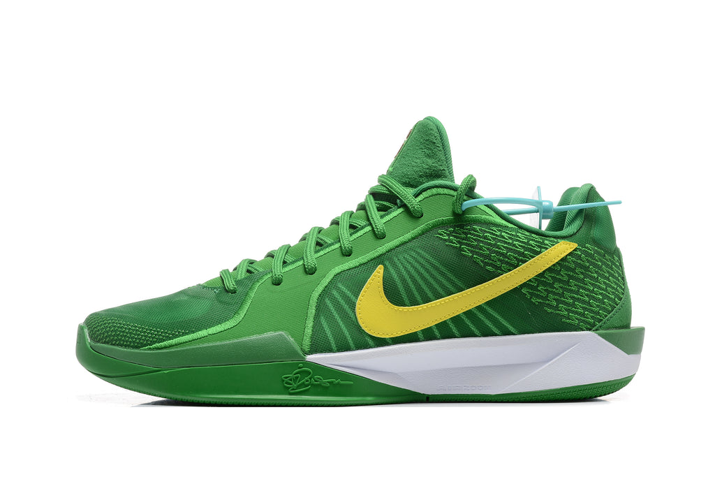 Side profile of a green Nike Sabrina 2 basketball shoe with a yellow Swoosh and white-and-green sole.