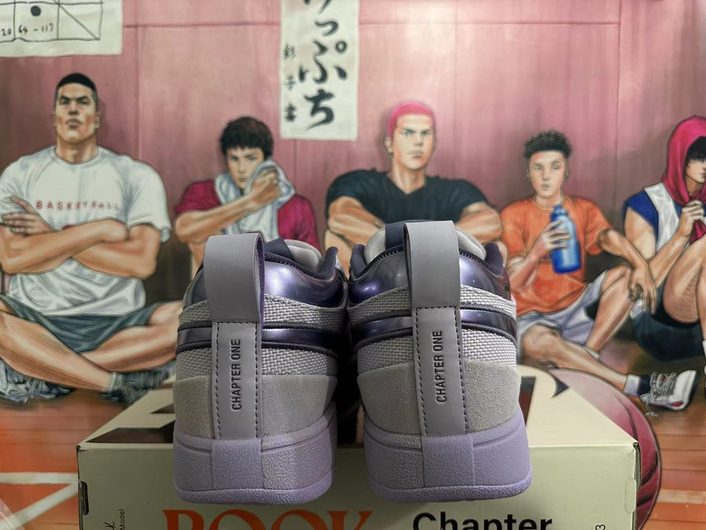 Rear view of gray and purple low-top sneakers with Chapter One heel tabs