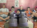 Rear view of gray and purple low-top sneakers with Chapter One heel tabs