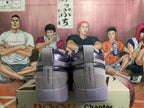 Rear view of gray and purple low-top sneakers with Chapter One heel tabs