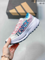 Side view of the running shoe showing large blue and black branding details, pink upper accents, and a white midsole; size range text 40–45 is visible.