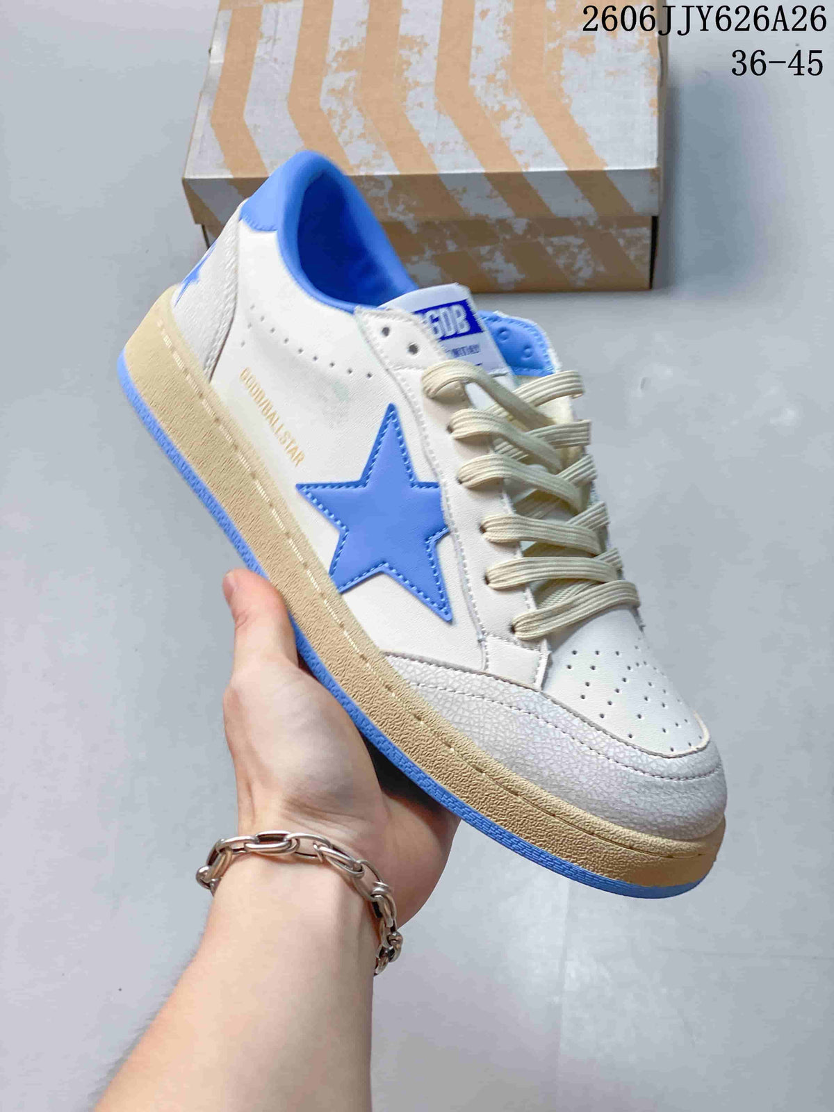 Angled side view showing the blue star, white upper, cream laces, and distressed beige-toned midsole.