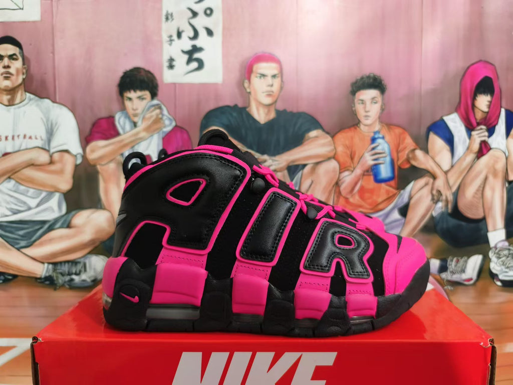 Side view showing oversized AIR lettering on black and bright pink Nike sneakers