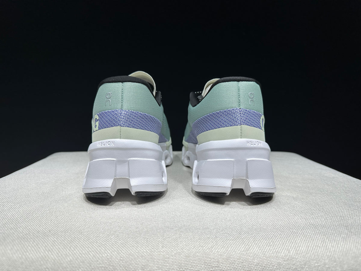 Rear view of the pair showing purple heel bands and sculpted white soles.