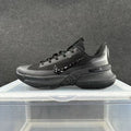Side view of an all-black Nike LeBron basketball shoe with a textured upper and sculpted sole