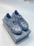 Pair of gray Ecco closed-toe clogs with lace-up fronts, shown on a box.