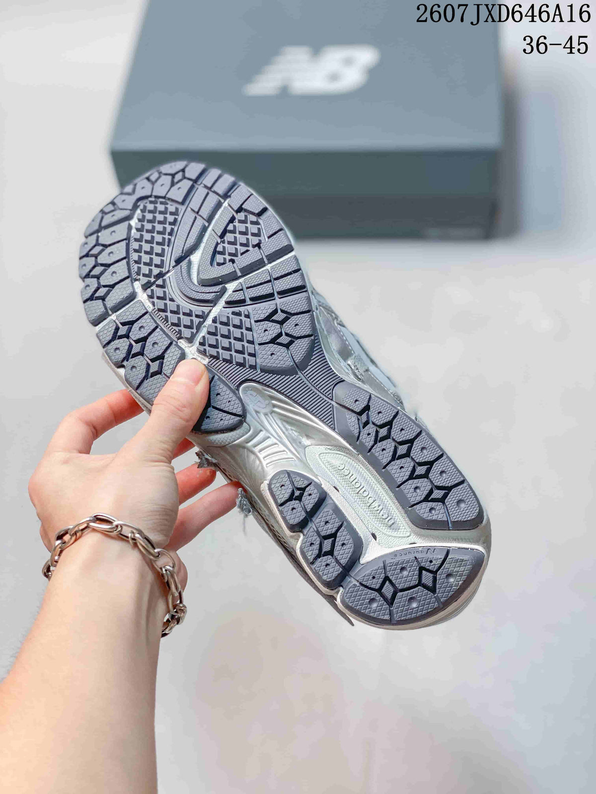 Bottom view of a New Balance 1906A sneaker showing the segmented patterned outsole.
