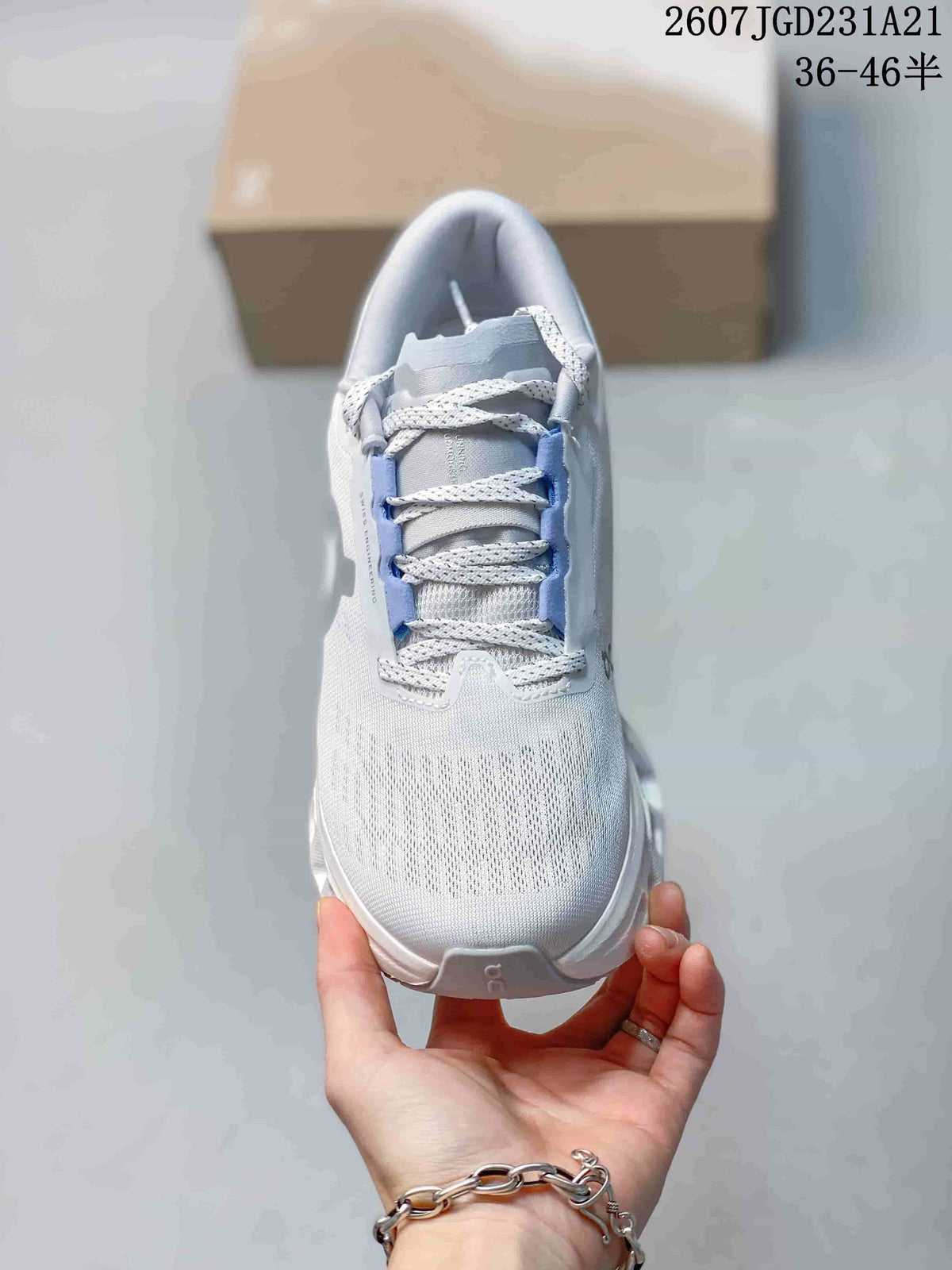 Top view showing the lace-up front, tongue, and textured light-colored upper.