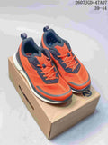 Pair of orange and navy ECCO sneakers displayed on a shoebox, with the source size range and code visible at the top.