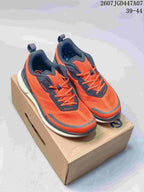 Pair of orange and navy ECCO sneakers displayed on a shoebox, with the source size range and code visible at the top.
