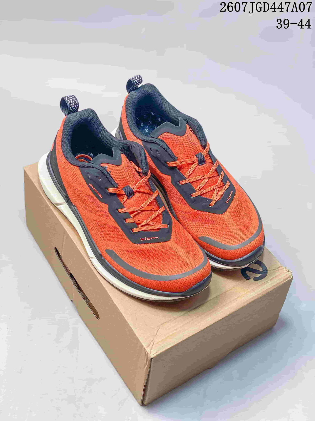 Pair of orange and navy ECCO sneakers displayed on a shoebox, with the source size range and code visible at the top.
