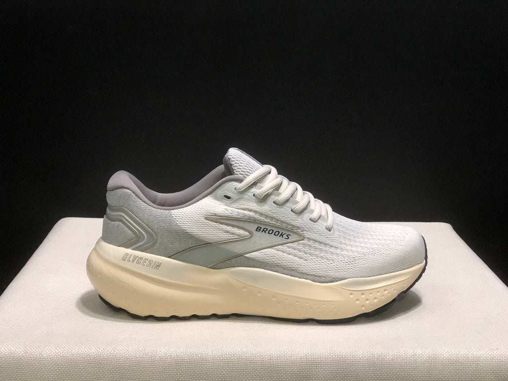 Single side profile of the white Brooks Glycerin 21 sneaker showing the Glycerin branding on the heel-side midsole.