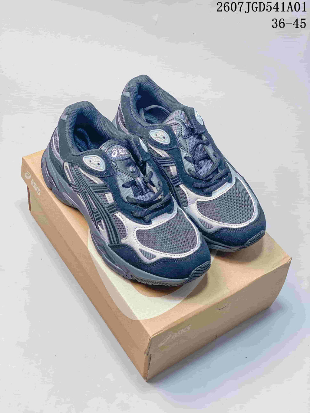 Pair of navy and silver ASICS GEL-NYC 2.0 sneakers shown from above