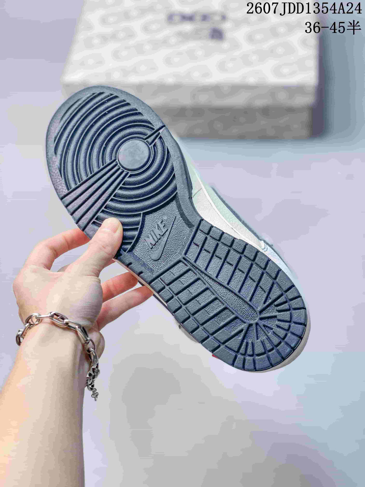 Close-up of the sneaker outsole showing a circular forefoot tread and segmented rubber pattern.