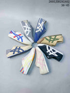 Several Onitsuka Tiger slip-on sneakers arranged in different colorways
