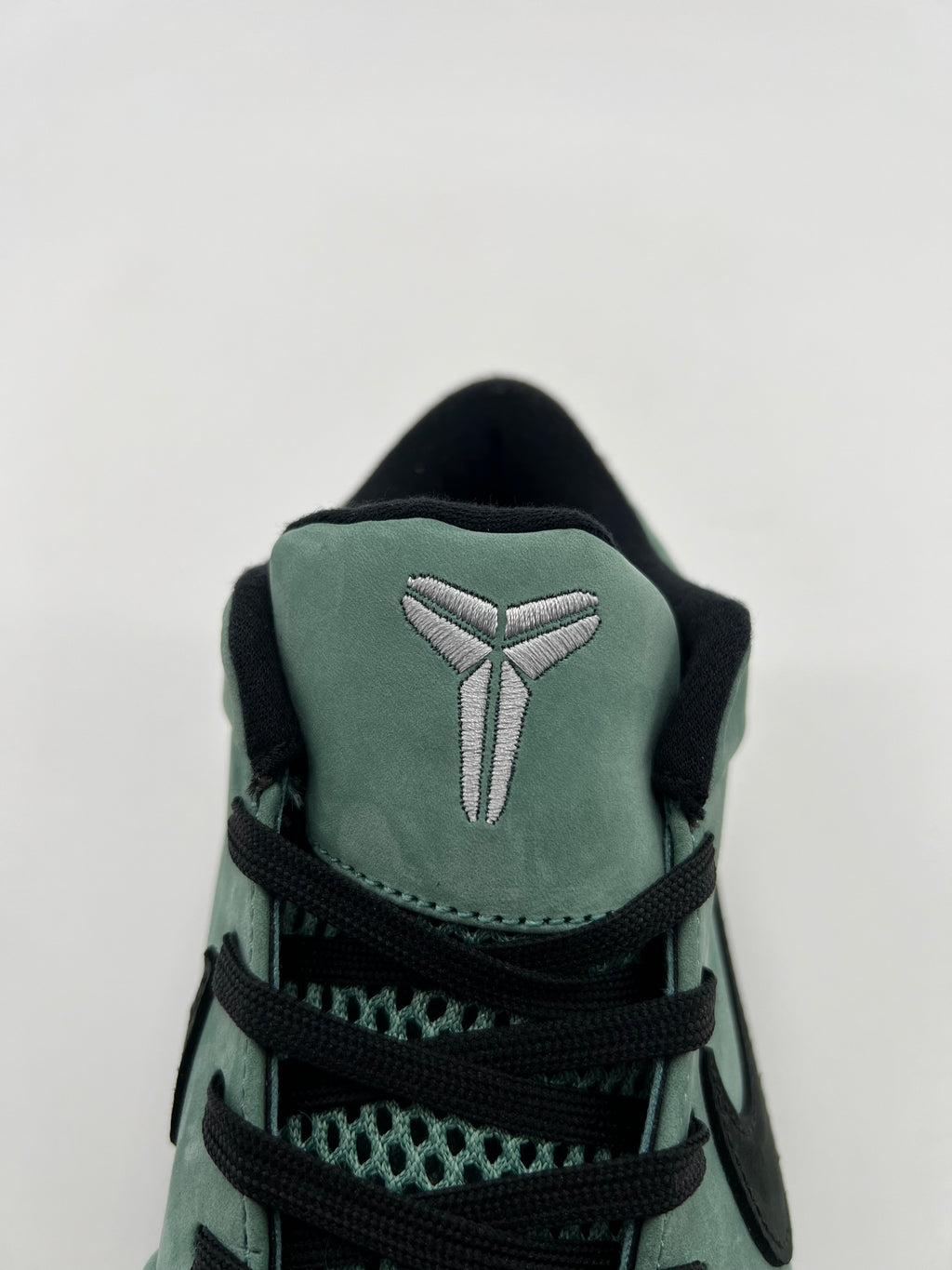 Front close-up of the embroidered tongue logo
