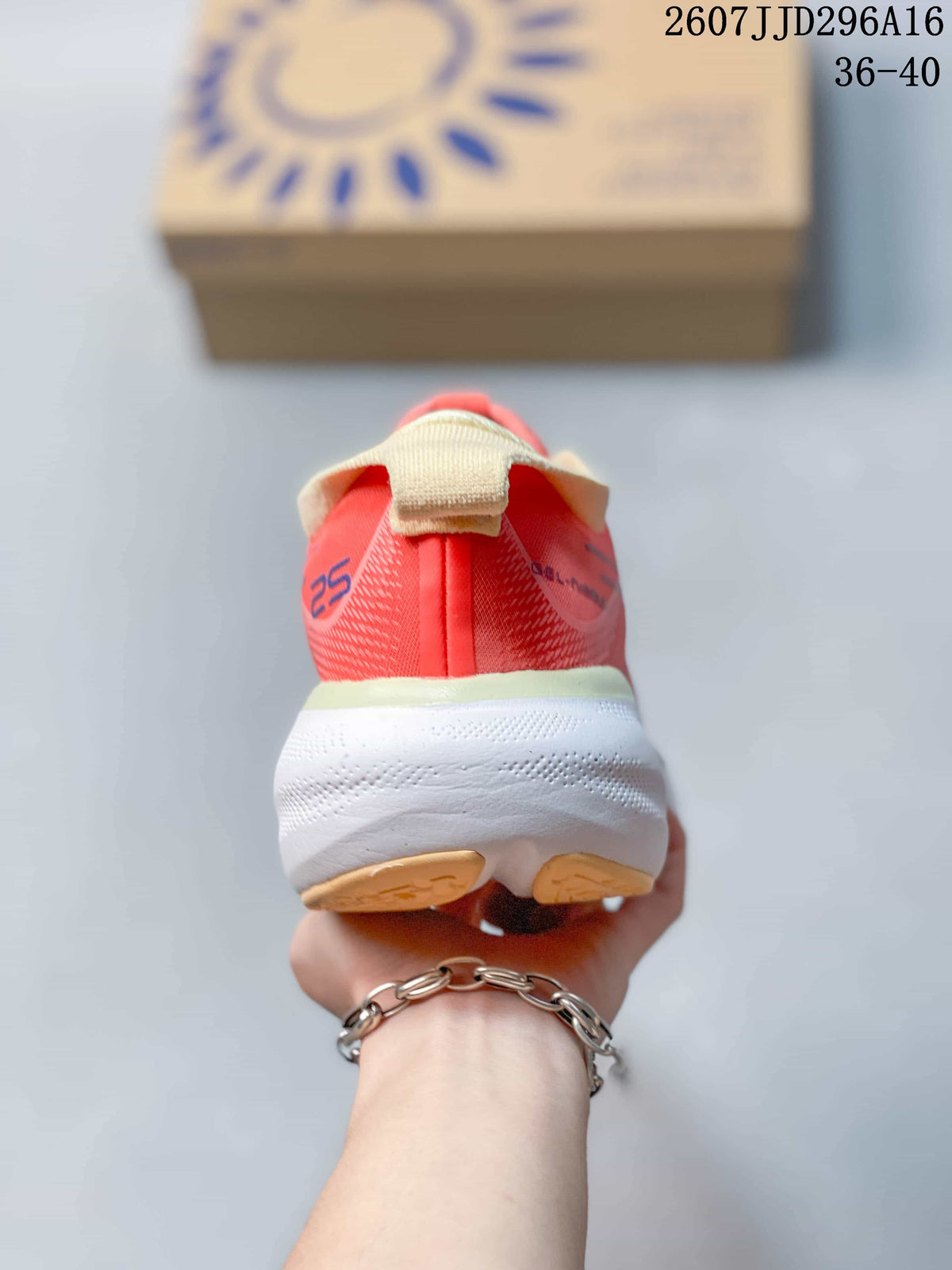 Rear view of the coral pink running shoe showing the heel pull tab, cream collar and white midsole.