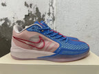 Side view of a blue and pink Nike Kobe basketball shoe with a contrasting Swoosh and translucent-looking outsole