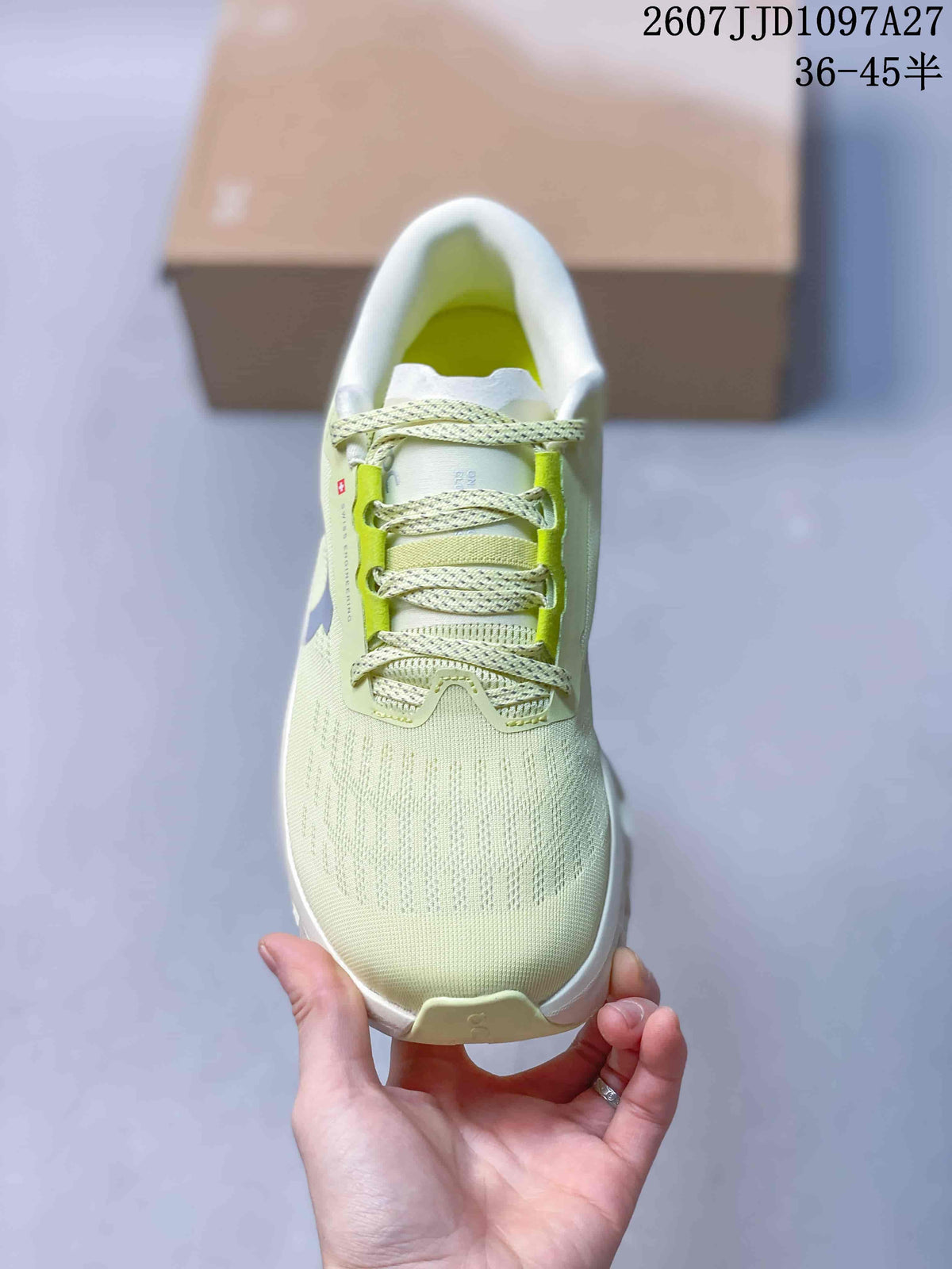 Top view of the pale green sneaker showing the lace-up closure, padded collar and textured upper.