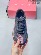 Top view showing the laces, dark upper and pink toe branding