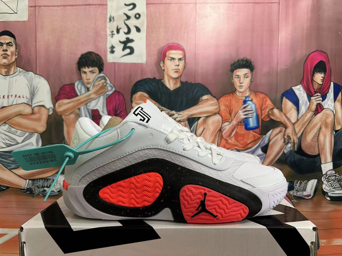 Side view of a white basketball shoe with black and red panels