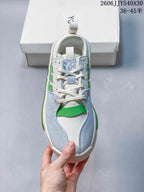Top view of a white, green and light-blue Y-3 Rivalry sneaker